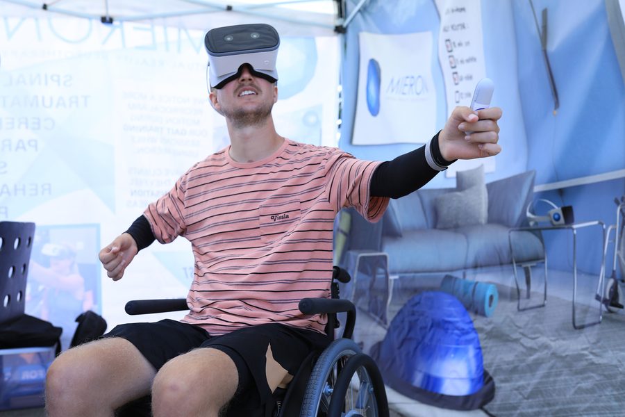 A wheelchair user engaged in a MIERON VR neurotherapy experience